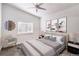 Cozy bedroom boasts lots of natural light, hardwood floors and neutral color palette at 7450 S Eastern Ave # 2073, Las Vegas, NV 89123