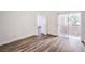 Bright bedroom with wood floors and sliding glass door to a balcony at 7450 S Eastern Ave # 2073, Las Vegas, NV 89123