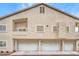 Exterior shot of townhome shows attached garages and private balconies at 7450 S Eastern Ave # 2073, Las Vegas, NV 89123