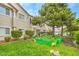 Exterior features a community garden, manicured lawn and mature trees at 7450 S Eastern Ave # 2073, Las Vegas, NV 89123
