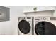 Laundry area featuring modern, front-load washer and dryer and storage shelves at 7450 S Eastern Ave # 2073, Las Vegas, NV 89123