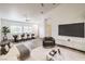 A staged living room featuring an open floor plan including a dining room and kitchen at 7450 S Eastern Ave # 2073, Las Vegas, NV 89123