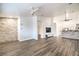 Bright, open living area featuring hardwood floors and modern fixtures, with easy access to the kitchen at 7450 S Eastern Ave # 2073, Las Vegas, NV 89123
