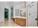 Bright bathroom with tile flooring, shower and door to walk-in closet at 7504 Via Sistina St, Las Vegas, NV 89131