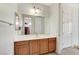 Bathroom with a long vanity and a large mirror at 7504 Via Sistina St, Las Vegas, NV 89131