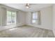 Sunlit bedroom with carpet and windows at 7504 Via Sistina St, Las Vegas, NV 89131