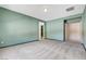 Spacious bedroom with neutral carpet, plenty of wall space, and multiple entryways at 7504 Via Sistina St, Las Vegas, NV 89131