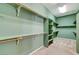 Large walk-in closet featuring shelving and rods for optimal storage at 7504 Via Sistina St, Las Vegas, NV 89131