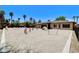 Spacious dog park in the backyard with various agility equipment and landscaping, perfect for active pets at 7504 Via Sistina St, Las Vegas, NV 89131
