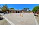 Large backyard dog park with a variety of play structures and ample space for dogs to exercise at 7504 Via Sistina St, Las Vegas, NV 89131