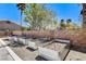 Backyard featuring several raised garden beds with gravel, creating an ideal space for gardening and landscaping at 7504 Via Sistina St, Las Vegas, NV 89131