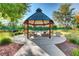 Community gazebo with picnic tables and grill, perfect for outdoor gatherings in a landscaped setting at 7504 Via Sistina St, Las Vegas, NV 89131