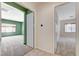 Hallway view showcasing open doorways into spacious rooms with neutral carpet and natural light at 7504 Via Sistina St, Las Vegas, NV 89131