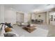 Spacious living area with dining area, neutral decor, and ample natural light at 7504 Via Sistina St, Las Vegas, NV 89131