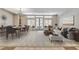 Bright living room boasts an open floor plan, and lots of natural light from the sliding glass doors at 7504 Via Sistina St, Las Vegas, NV 89131