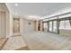 Expansive living area with lots of natural light, neutral decor, and access to the backyard at 7504 Via Sistina St, Las Vegas, NV 89131