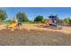 A colorful and fun playground area with slides and equipment for outdoor play at 7504 Via Sistina St, Las Vegas, NV 89131