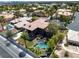 Backyard aerial view features a pool, spa, landscaping, and outdoor living spaces at 7520 Captains Harbor Dr, Las Vegas, NV 89117