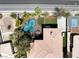 An aerial view highlights a custom pool, and lush landscaping, creating a private backyard oasis at 7520 Captains Harbor Dr, Las Vegas, NV 89117