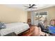 Bedroom boasts balcony access, neutral walls and a hardwood floor at 7520 Captains Harbor Dr, Las Vegas, NV 89117