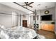 Primary bedroom with a four poster bed, fireplace, tv, and hardwood floors at 7520 Captains Harbor Dr, Las Vegas, NV 89117