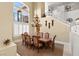 Elegant dining room with a grand chandelier and high ceilings at 7520 Captains Harbor Dr, Las Vegas, NV 89117