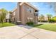 Home exterior featuring a well-manicured lawn and a view of the backyard pool at 7520 Captains Harbor Dr, Las Vegas, NV 89117