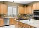 Kitchen boasting stainless appliances, granite countertops, and ample counter space at 7520 Captains Harbor Dr, Las Vegas, NV 89117