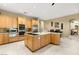 Bright kitchen featuring tile floors, granite countertops, and stainless steel appliances at 7520 Captains Harbor Dr, Las Vegas, NV 89117