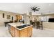 Open kitchen featuring a center island with granite countertops, and adjoining dining area at 7520 Captains Harbor Dr, Las Vegas, NV 89117