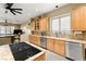 Well-lit kitchen featuring a center island, granite countertops, and ample cabinetry at 7520 Captains Harbor Dr, Las Vegas, NV 89117