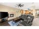 Living room featuring a fireplace, modern decor, and an open floor plan at 7520 Captains Harbor Dr, Las Vegas, NV 89117