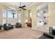 Spacious living room featuring large windows, high ceilings, and a dining area at 7520 Captains Harbor Dr, Las Vegas, NV 89117
