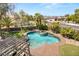 Inviting backyard pool and spa surrounded by lush landscaping and mature palm trees at 7520 Captains Harbor Dr, Las Vegas, NV 89117