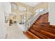 Elegant staircase with wood steps and decorative railing, leading to the upper level at 7520 Captains Harbor Dr, Las Vegas, NV 89117