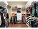 Organized walk-in closet with custom shelving, hanging racks, and ample storage space for clothes and shoes at 7520 Captains Harbor Dr, Las Vegas, NV 89117