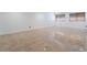 View of the spacious basement featuring tile flooring, baseboards, and windows with coverings at 7526 Gossamer Wind St, Las Vegas, NV 89139