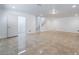 Spacious basement featuring tile floors, neutral walls, and a walkout stairwell at 7526 Gossamer Wind St, Las Vegas, NV 89139