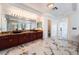 Spacious bathroom boasting double sinks, ample counter space, and marble floors at 7526 Gossamer Wind St, Las Vegas, NV 89139
