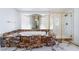Bathroom with a jacuzzi tub, glass shower, and marble flooring at 7526 Gossamer Wind St, Las Vegas, NV 89139