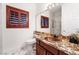 Bathroom features copper sink, decorative granite countertop, and cherry wood cabinets at 7526 Gossamer Wind St, Las Vegas, NV 89139