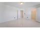 Bright bedroom with tile floors, featuring multiple entryways and closet at 7526 Gossamer Wind St, Las Vegas, NV 89139