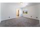 Bright bedroom with carpeted floors, neutral walls, and a window overlooking the neighborhood at 7526 Gossamer Wind St, Las Vegas, NV 89139