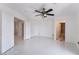 Bright bedroom with white walls, ceiling fan, and access to en-suite bath at 7526 Gossamer Wind St, Las Vegas, NV 89139
