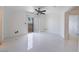 Bedroom with a ceiling fan, tile floors, and access to a balcony at 7526 Gossamer Wind St, Las Vegas, NV 89139