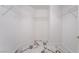 Walk-in closet with built-in shelving and marble tile flooring at 7526 Gossamer Wind St, Las Vegas, NV 89139