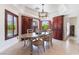 Charming dining area with pool view, designer lighting, and custom built-in cabinetry at 7526 Gossamer Wind St, Las Vegas, NV 89139