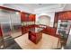 Beautiful kitchen featuring stainless steel appliances, granite countertops, and an island at 7526 Gossamer Wind St, Las Vegas, NV 89139