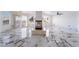 Open-concept living room with tile floors and a modern fireplace at 7526 Gossamer Wind St, Las Vegas, NV 89139