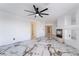 Large living room with high ceiling, white walls, and marble tile floor at 7526 Gossamer Wind St, Las Vegas, NV 89139
